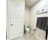 Clean bathroom with toilet, flooring, and a linen closet at 178 Brofield St, Brooksville, FL 34604