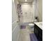 Clean bathroom with a shower/tub combo and dark vanity at 178 Brofield St, Brooksville, FL 34604
