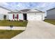One-story house with a two-car garage and landscaping at 178 Brofield St, Brooksville, FL 34604