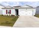 One-story house with a two-car garage and landscaping at 178 Brofield St, Brooksville, FL 34604