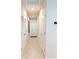 Clean and bright hallway with tile flooring and doors at 178 Brofield St, Brooksville, FL 34604