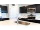Modern kitchen features stainless steel appliances and white quartz countertops at 178 Brofield St, Brooksville, FL 34604