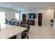 Open living area with a large TV and comfortable seating at 178 Brofield St, Brooksville, FL 34604