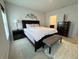 Main bedroom with a king-size bed, nightstand, and dresser at 178 Brofield St, Brooksville, FL 34604