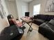 Home office space with desk, comfortable couch, and large window at 178 Brofield St, Brooksville, FL 34604
