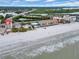 Aerial showing beachfront property, bridge, and ocean at 18838 Gulf Blvd # 202, Indian Shores, FL 33785