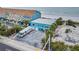 Aerial view showcasing beachfront property, RV parking, and ocean at 18838 Gulf Blvd # 202, Indian Shores, FL 33785