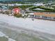 Aerial view of beachfront property, bridge, and ocean at 18838 Gulf Blvd # 202, Indian Shores, FL 33785