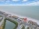Aerial view of beachfront property, showing ocean, beach, and buildings at 18838 Gulf Blvd # 202, Indian Shores, FL 33785