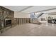 Unfinished basement with tiled floor and stone fireplace at 18838 Gulf Blvd # 202, Indian Shores, FL 33785