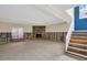 Unfinished basement with tiled floor and stone fireplace at 18838 Gulf Blvd # 202, Indian Shores, FL 33785