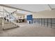 Unfinished basement with tiled floor and stone fireplace at 18838 Gulf Blvd # 202, Indian Shores, FL 33785