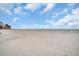 Expansive beachfront view with white sand and blue sky at 18838 Gulf Blvd # 202, Indian Shores, FL 33785
