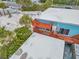 Elevated deck with wooden railings overlooking the neighborhood at 18838 Gulf Blvd # 202, Indian Shores, FL 33785