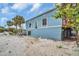 Beachfront building exterior with sandy area at 18838 Gulf Blvd # 202, Indian Shores, FL 33785