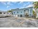 Beachfront building exterior with parking and RV at 18838 Gulf Blvd # 202, Indian Shores, FL 33785