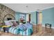 Living room with hardwood floors and stone fireplace at 18838 Gulf Blvd # 202, Indian Shores, FL 33785