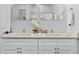 Double vanity bathroom with modern white cabinets and quartz countertops at 189 Statler St, Port Charlotte, FL 33954
