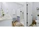Modern bathroom with double vanity and shower/tub combo at 189 Statler St, Port Charlotte, FL 33954