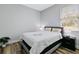 Comfortable bedroom with a queen-size bed and wood floors at 189 Statler St, Port Charlotte, FL 33954