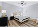 Spacious bedroom with a queen bed and ceiling fan at 189 Statler St, Port Charlotte, FL 33954