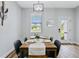 Dining area with wooden table, four chairs, and a view at 189 Statler St, Port Charlotte, FL 33954