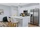 Modern kitchen with white cabinets, stainless steel appliances, and island at 189 Statler St, Port Charlotte, FL 33954
