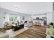 Open floor plan living room with hardwood floors and access to kitchen at 189 Statler St, Port Charlotte, FL 33954