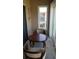 Small balcony with table and chairs, ideal for relaxing outdoors at 255 Capri N Cir # 17, Treasure Island, FL 33706