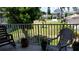 Relaxing balcony overlooking grassy area with two chairs at 255 Capri N Cir # 17, Treasure Island, FL 33706