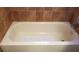 Clean bathtub with non-slip mat in a well-lit bathroom at 255 Capri N Cir # 17, Treasure Island, FL 33706
