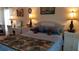Cozy bedroom with a queen-size bed, two nightstands, and ample closet space at 255 Capri N Cir # 17, Treasure Island, FL 33706