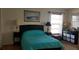 Cozy bedroom with a double bed, and ample closet space at 255 Capri N Cir # 17, Treasure Island, FL 33706