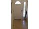 Front entry with tile floor and stained-glass window at 255 Capri N Cir # 17, Treasure Island, FL 33706