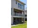 Two-story building with balconies and landscaping at 255 Capri N Cir # 17, Treasure Island, FL 33706