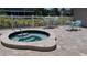Community hot tub with patio furniture at 255 Capri N Cir # 17, Treasure Island, FL 33706