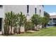 Landscaped area with flowering hibiscus trees at 255 Capri N Cir # 17, Treasure Island, FL 33706
