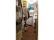 Laundry room with washer, dryer, and storage shelves at 255 Capri N Cir # 17, Treasure Island, FL 33706