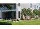 Ground level patio with spiral staircase and potted plants at 255 Capri N Cir # 17, Treasure Island, FL 33706