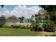 Community pool area with building and landscaping at 255 Capri N Cir # 17, Treasure Island, FL 33706