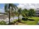 Community pool and spa with patio furniture and lush landscaping at 255 Capri N Cir # 17, Treasure Island, FL 33706