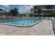 Community swimming pool with surrounding patio at 255 Capri N Cir # 17, Treasure Island, FL 33706