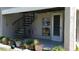 Exterior features a spiral staircase and potted plants at 255 Capri N Cir # 17, Treasure Island, FL 33706