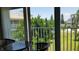 Balcony view overlooking lush landscaping and neighborhood homes at 255 Capri N Cir # 17, Treasure Island, FL 33706