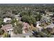 Aerial view of a residential neighborhood with lush trees at 2712 Mock Orange Ct, Valrico, FL 33594