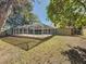 Spacious backyard with screened-in pool at 2712 Mock Orange Ct, Valrico, FL 33594
