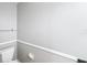 Simple bathroom with toilet and glass shelves at 2712 Mock Orange Ct, Valrico, FL 33594