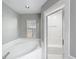 Bathroom with soaking tub, shower, and gray walls at 2712 Mock Orange Ct, Valrico, FL 33594