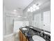 Bathroom boasts double sinks, granite countertop and a separate shower at 2712 Mock Orange Ct, Valrico, FL 33594
