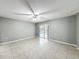 Bedroom with tile floors and sliding glass doors to the pool area at 2712 Mock Orange Ct, Valrico, FL 33594